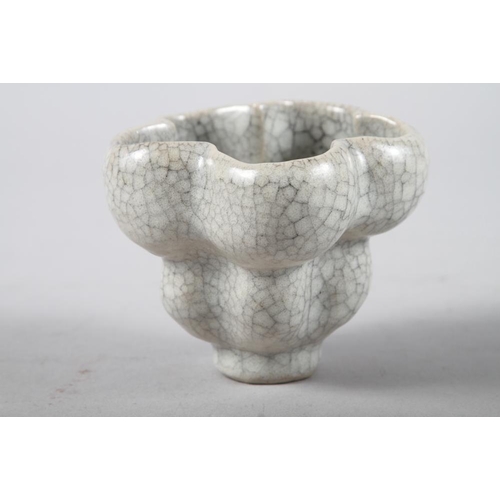 72 - A studio pottery lobed vase with crackle glaze, 3