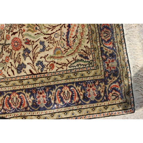 757 - A Persian tree of life design rug with floral multi-borders in shades of natural, blue and terracott... 