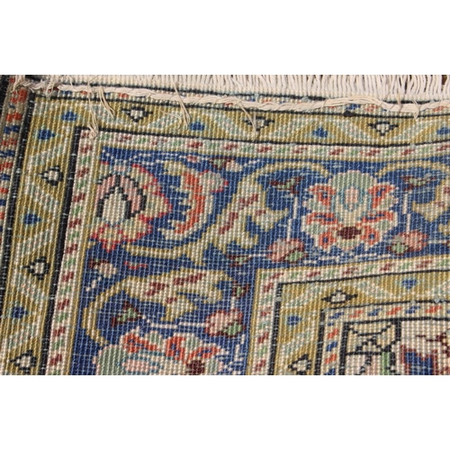 757 - A Persian tree of life design rug with floral multi-borders in shades of natural, blue and terracott... 