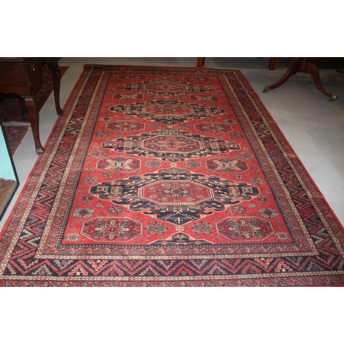 763 - A Royal Keshan carpet of traditional Persian design with four medallions on a red ground, 120” x 78”... 