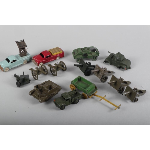 215 - A Britains pre-war Bren gun carrier, two 1950s AM tin-plate vehicles, a Britains field gun and other... 