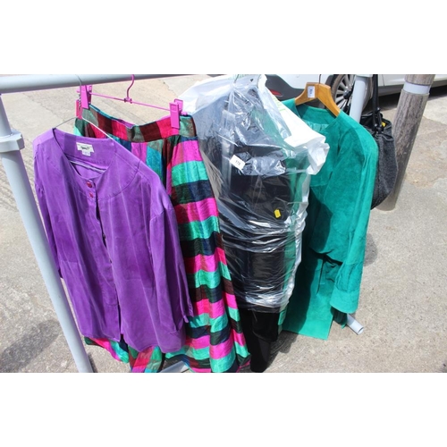 228 - A quantity of vintage and later clothing, including a green silk poncho, a pink and grey patterned c... 