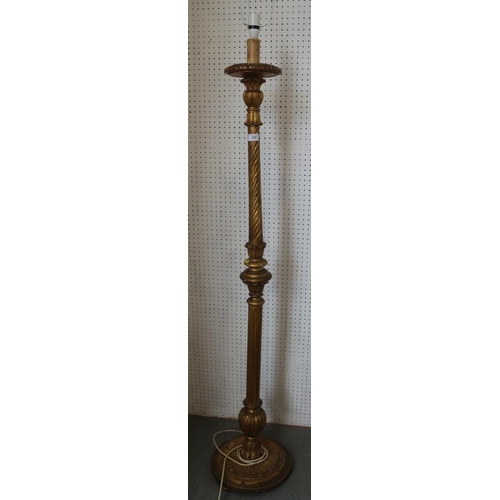 298 - A carved giltwood standard lamp, on circular base, 63 1/2