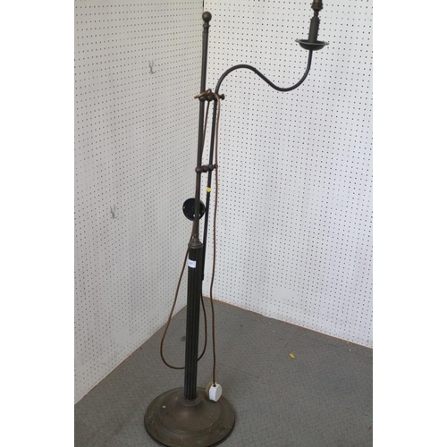 302 - A black metal standard lamp with fluted central column, on a circular base, 61