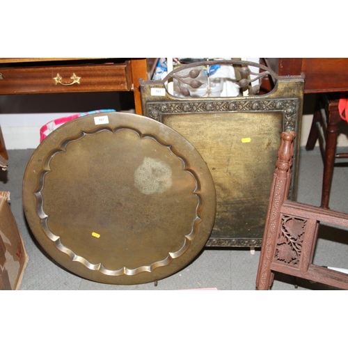 187 - An anodised brass fire screen, a white painted saucepan stand and a Middle Eastern engraved brass tr... 