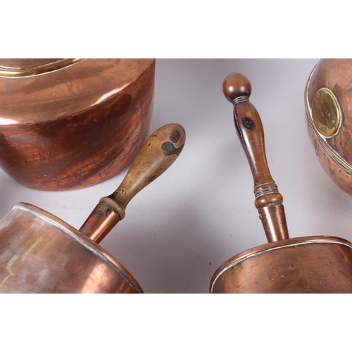 194 - Two 19th century copper scoops with turned wood handles, a copper kettle, a copper globular jug, by ... 