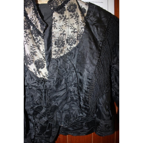 234 - A Victorian evening dress and jacket with netted and frilled sleeves and black brocade