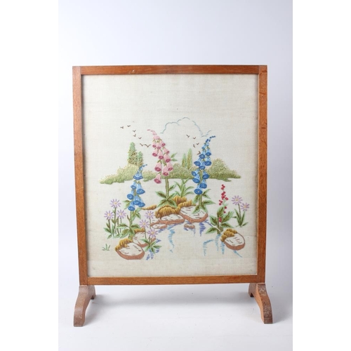 235 - A needlepoint alphabet panel, in gilt frame, a 1930s floral needlework panel fire screen, a needlepo... 