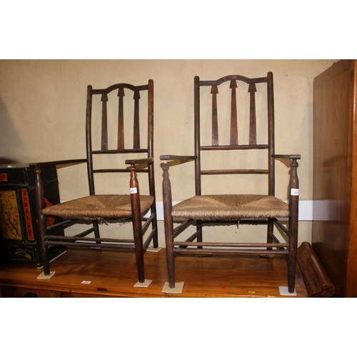 614 - A pair of Arts & Crafts rush seat elbow chairs with triple splat backs