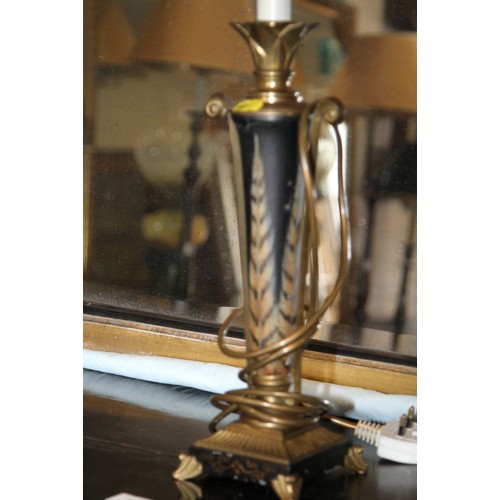 300 - A brass and black metal table lamp with feather decoration, on square base, 20