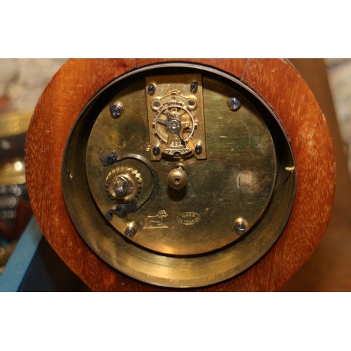 175 - An Edwardian mahogany and inlaid balloon mantel clock, supplied by Harrods, 7 1/2