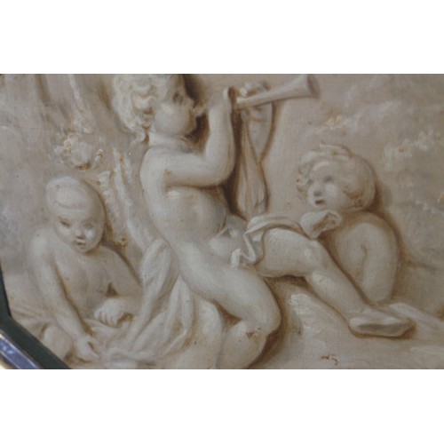 513 - A pair of 19th century trompe-l'oeil oil on panels, putti, 6 1/2