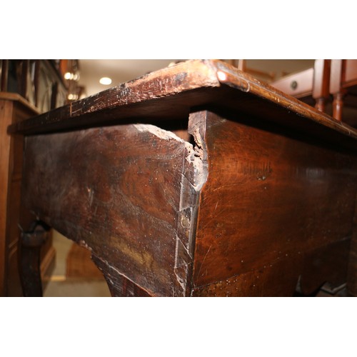 552 - A late 17th century/early 18th century oak lowboy, fitted three drawers over shaped kneehole, on cab... 