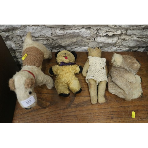 223 - A vintage teddy bear, a toy terrier, a koala bear, an Indian doll and other toys