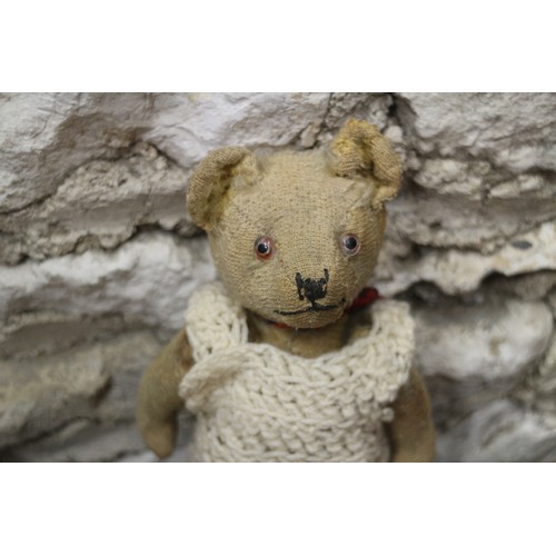 223 - A vintage teddy bear, a toy terrier, a koala bear, an Indian doll and other toys