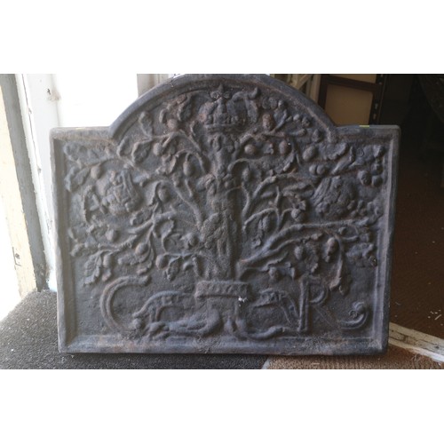 766 - A cast iron arch top fireback of 17th century design with Boscobel oak, 34