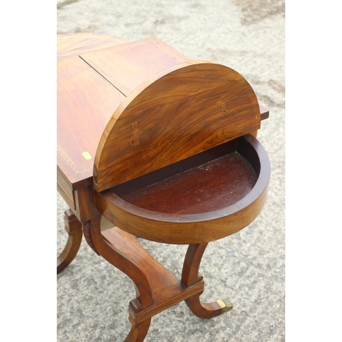 502 - A Victorian mahogany and inlaid flap top work table, on lyre end supports, 27 1/2