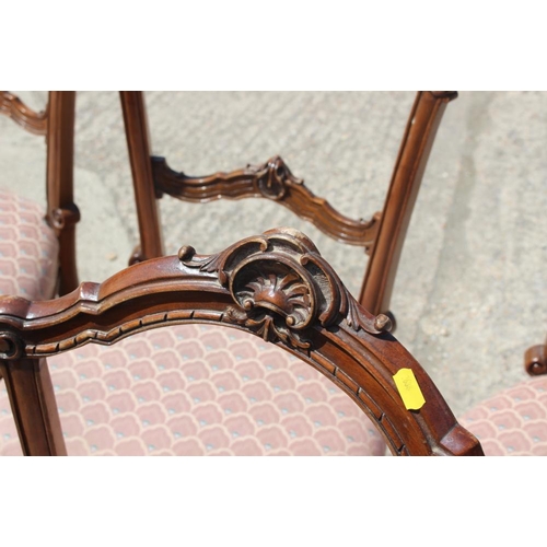 507 - A set of six late Victorian carved walnut bar back side chairs, upholstered in a fish scale ground f... 