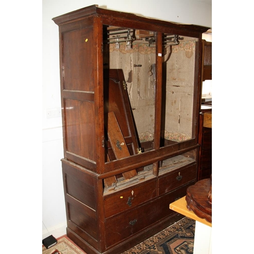 517 - An 18th century oak wardrobe, the upper section enclosed two Gothic panel doors over two faux drawer... 