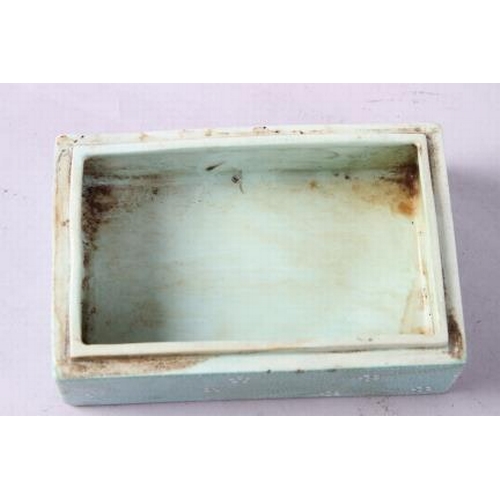 109 - A Chinese porcelain box and cover with verse and textured light green glaze, 4 3/4