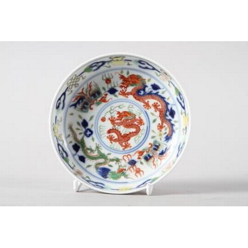 110 - A Chinese saucer dish, decorated red and green dragons with six character mark to base, 4 1/3