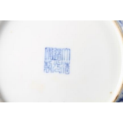 114 - A Chinese blue and white dish with scrolled and floral decoration and seal mark to base, 8