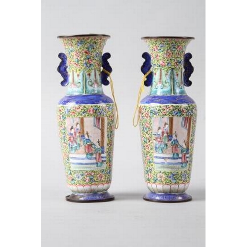 123 - A pair of Chinese Canton enamel cloisonne vases with panels decorated figures on a floral pattern ye... 