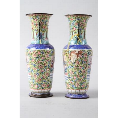 123 - A pair of Chinese Canton enamel cloisonne vases with panels decorated figures on a floral pattern ye... 