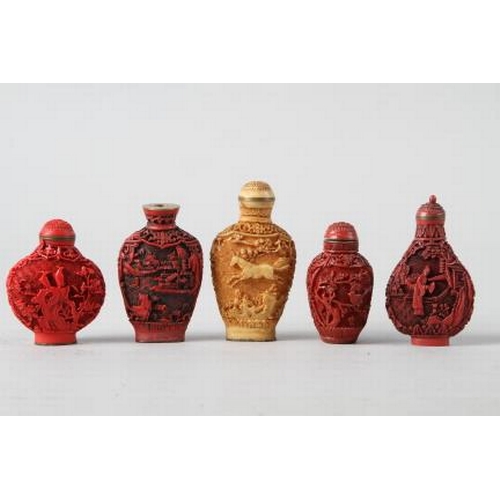 125 - Four Chinese cinnabar lacquered snuff bottles and another similar snuff bottle, largest 2 3/4