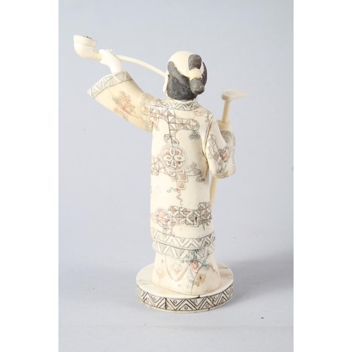 131 - A carved sectional bone figure of a kneeling Samurai archer, 12