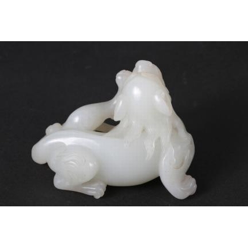 135 - A Chinese carved jade mythical beast, on hardwood stand, 3