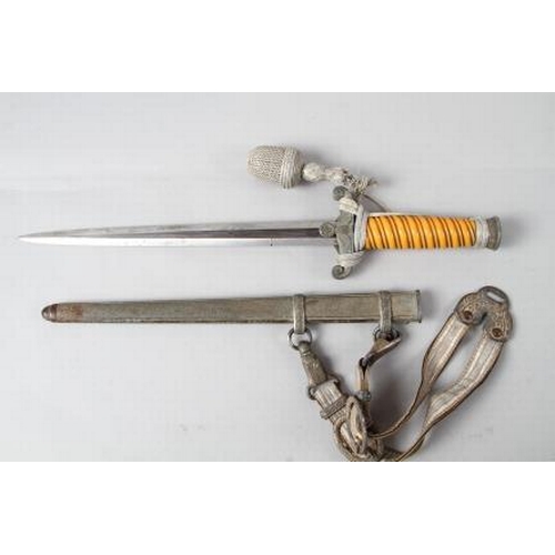 172 - An officer's German army dagger with strap and knot, in metal scabbard, maker WKC, 15 1/2