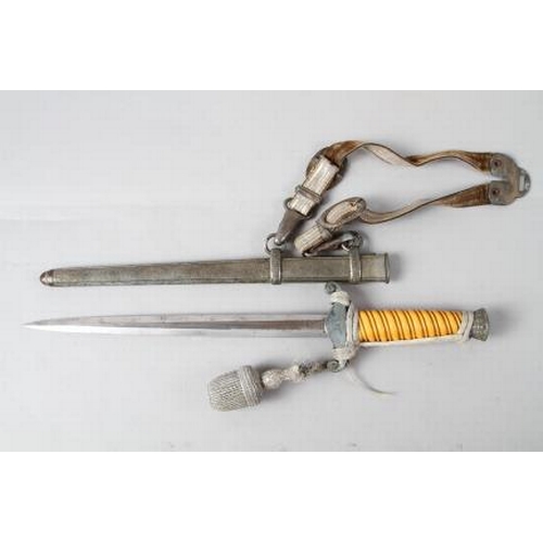 172 - An officer's German army dagger with strap and knot, in metal scabbard, maker WKC, 15 1/2