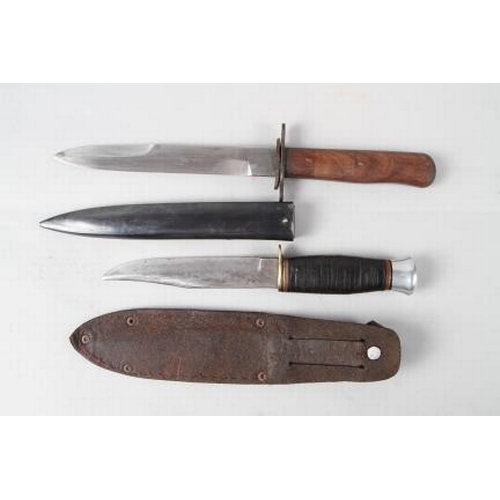 180 - A Bell's Bowie knife, in leather sheath, 9