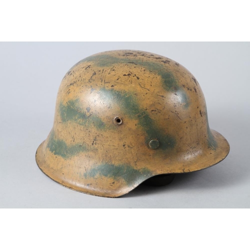 182 - An M42 camouflage helmet