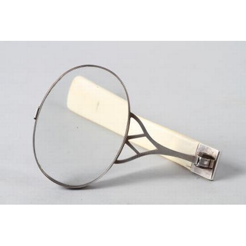 242 - A white metal folding magnifying glass, in ray skin case, and a tortoiseshell magnifying glass