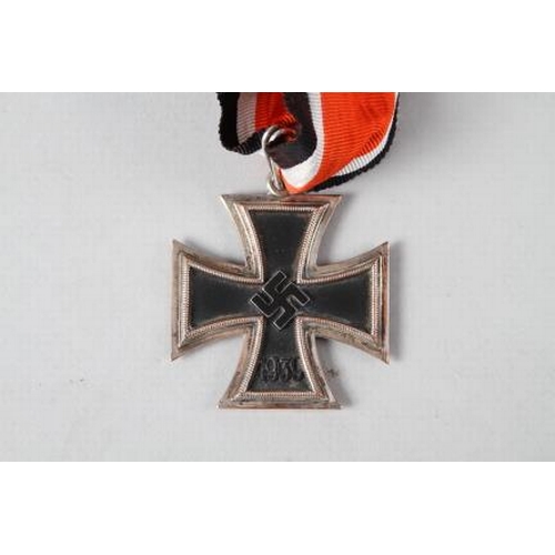 358 - A Knight's Cross of the Iron Cross medal, in case, a white cigarette case, stamped 900 and engraved ... 