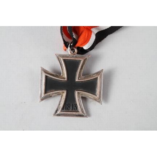 358 - A Knight's Cross of the Iron Cross medal, in case, a white cigarette case, stamped 900 and engraved ... 