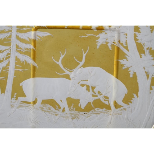 45 - A 19th century Bohemian yellow flashed and engraved plate with rutting stags design, 10 3/4