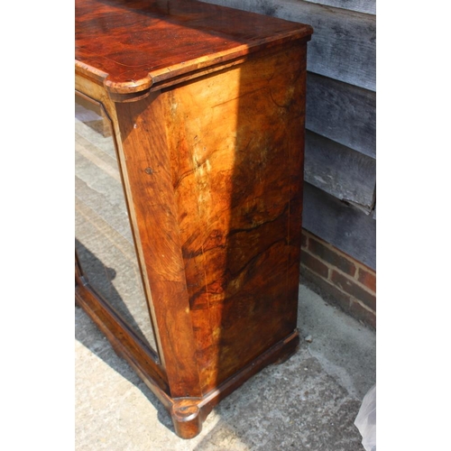 496 - A Victorian figured walnut and line inlaid music cabinet enclosed glazed panel door, on bracket feet... 