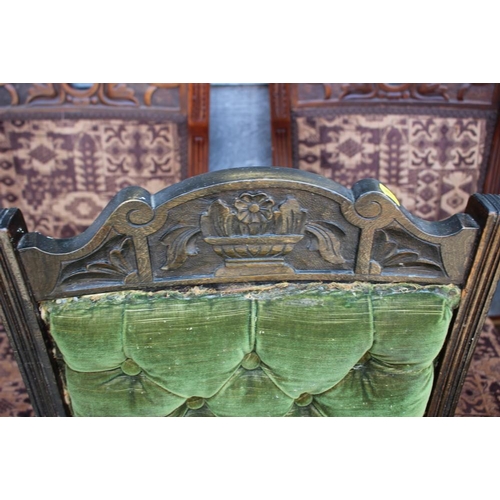 510 - A set of four late 19th century carved walnut side chairs with padded seats and backs, on turned and... 