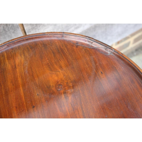 524 - A 19th century mahogany circular tilt top table, on turned column and tripod splay support, 17