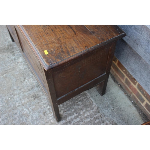 525 - An 18th century chip carved two panel front coffer, on stile supports, 42