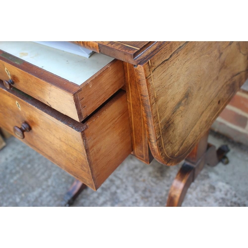 527 - A Regency rosewood work table, fitted three drawers and flap top, on panel end splay supports, 32