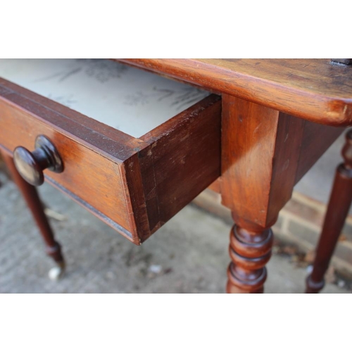 528 - A 19th century mahogany tray top washstand, fitted one drawer, on turned and castored supports, 31