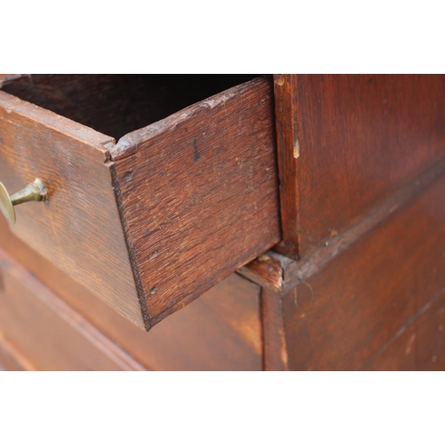 534 - An early 19th century Continental oak bombe-shape fall front bureau, the upper section fitted drawer... 