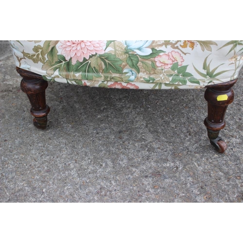 535 - A late 19th century low seat nursing chair, upholstered in a chinoiserie glazed chintz, on turned an... 