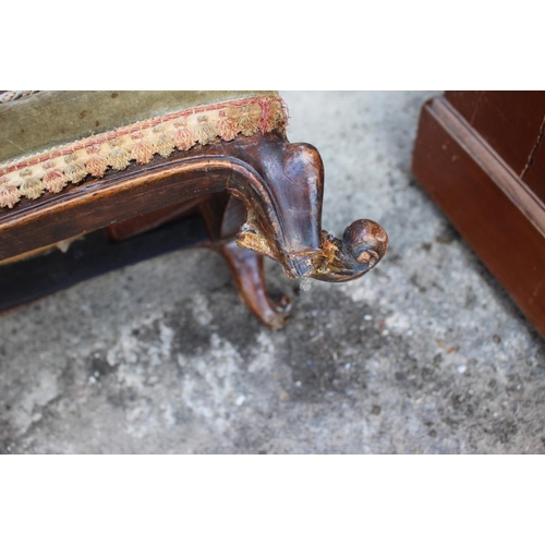 540 - A mid Victorian fender stool with needlepoint seat, on cabriole supports (one for restoration), 44