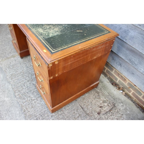 542 - A Victorian mahogany desk with tooled lined top, fitted seven drawers, on block base, 54