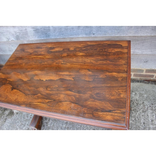 546 - An early Victorian rosewood centre table, fitted one drawer, on twin turned columns and scroll suppo... 